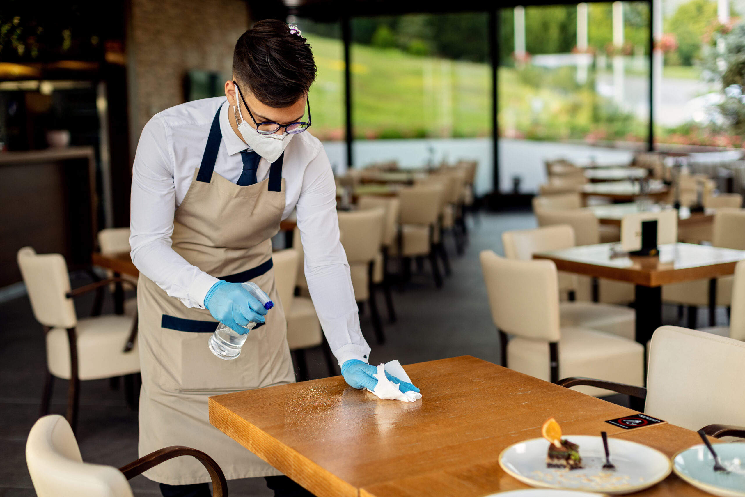 Professional team performing deep cleaning in a restaurant
